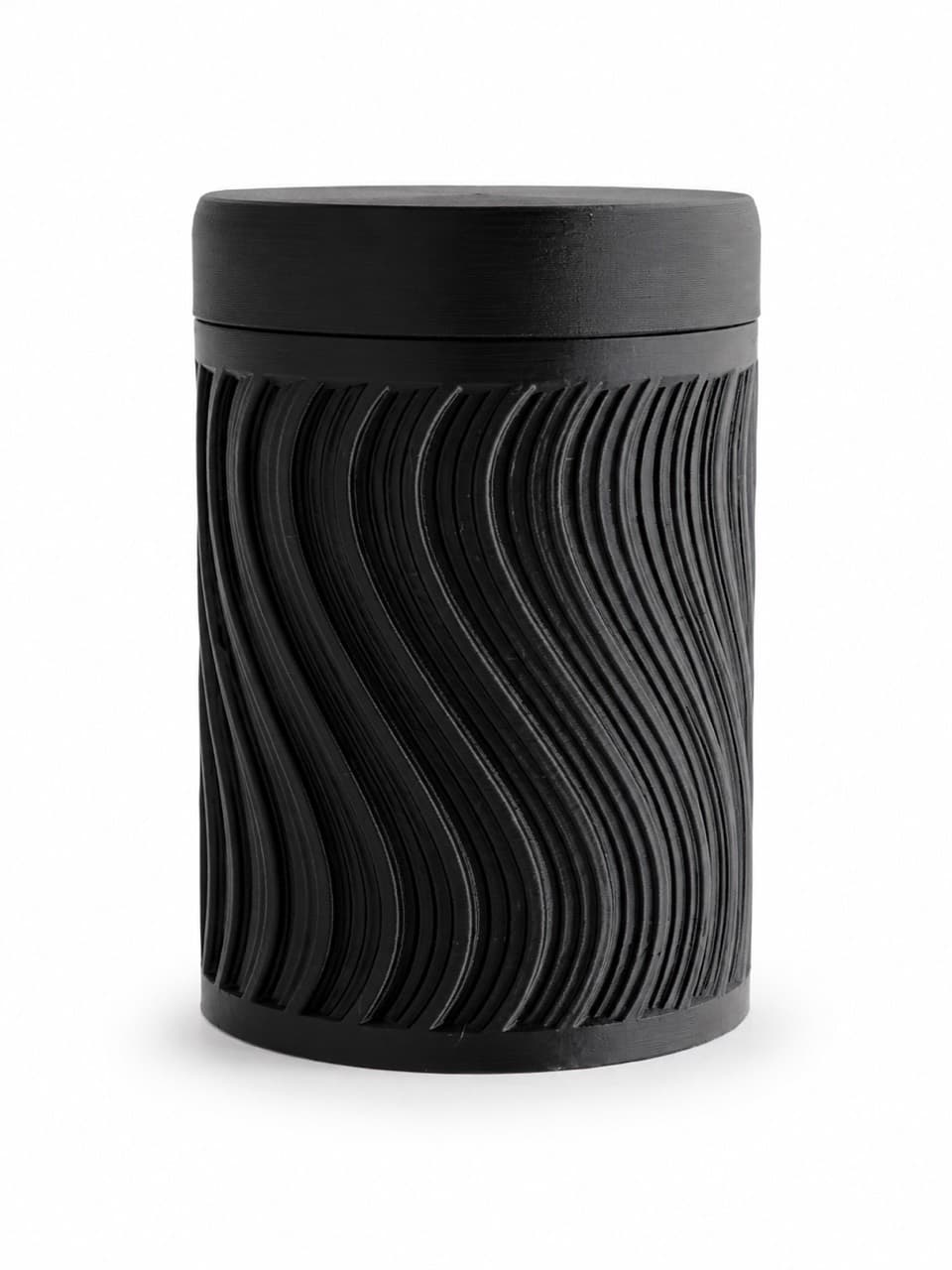 Black 3D-printed locking lid container with a raised wave texture